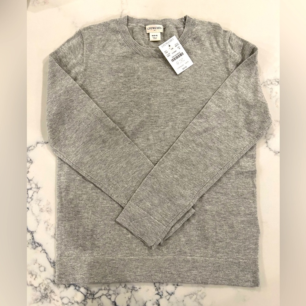 NWT. Little girls J. Crew gray sweater. Never worn. Size Medium (8-9).